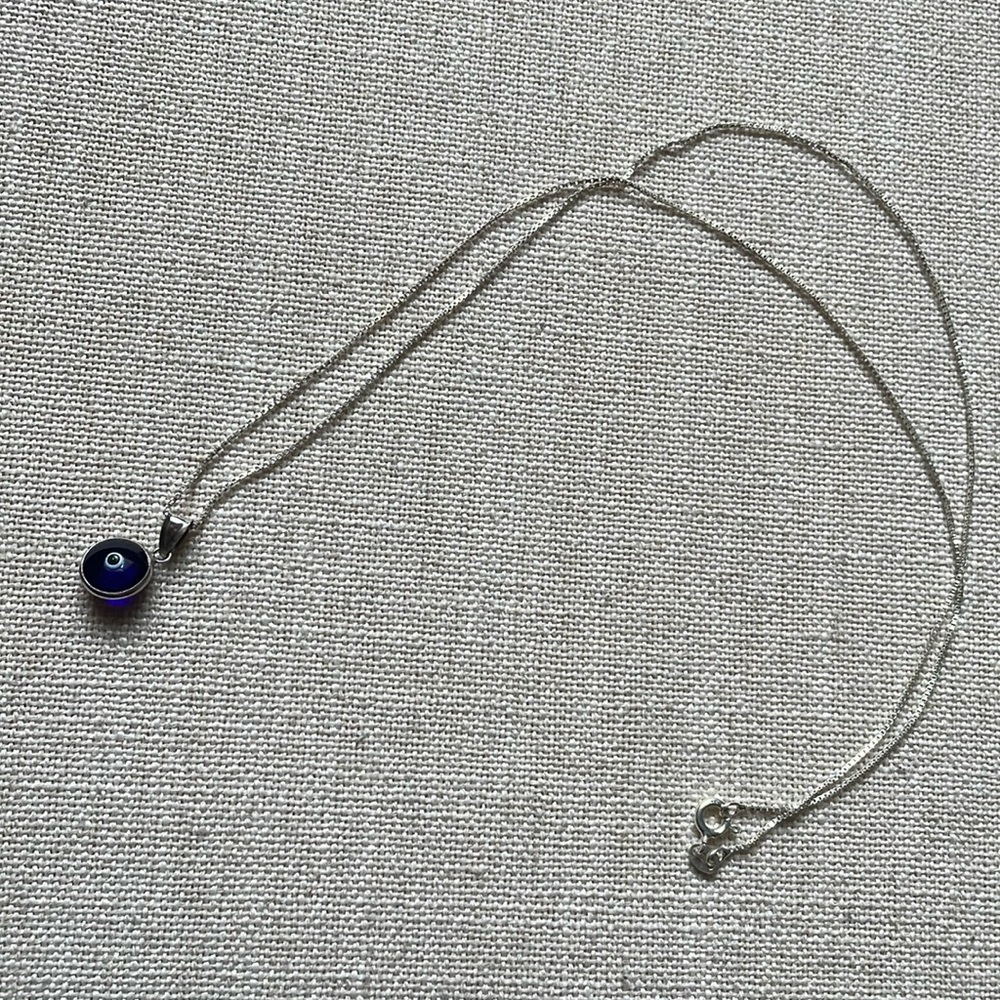 Evil Eye sterling silver 22” pendant necklace, in excellent condition.